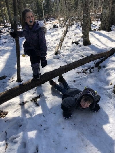 Kids having fun while hiking in Door County in winter.